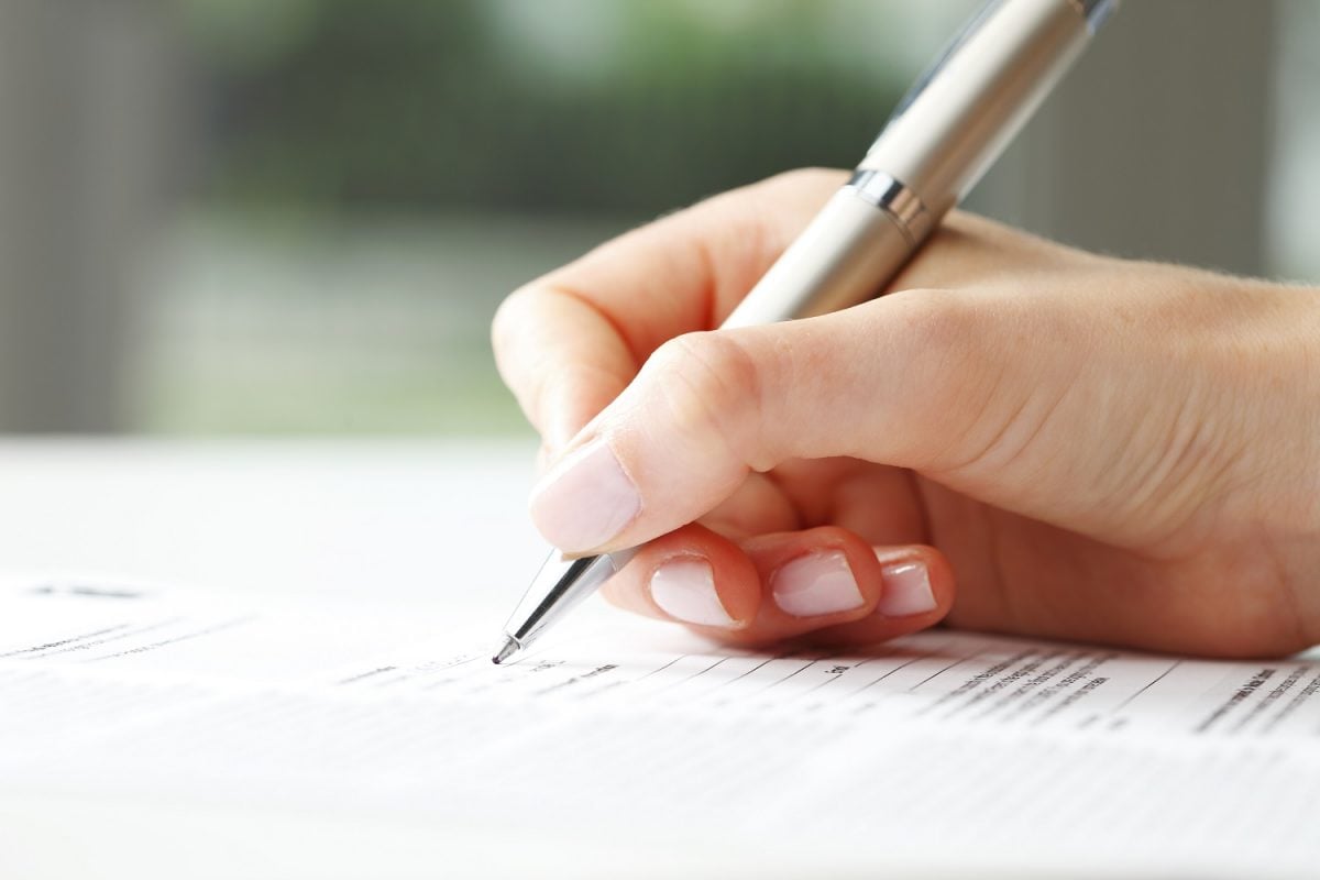 Woman's hand completing form