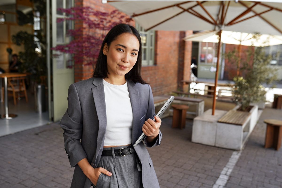 Business woman holding a laptop