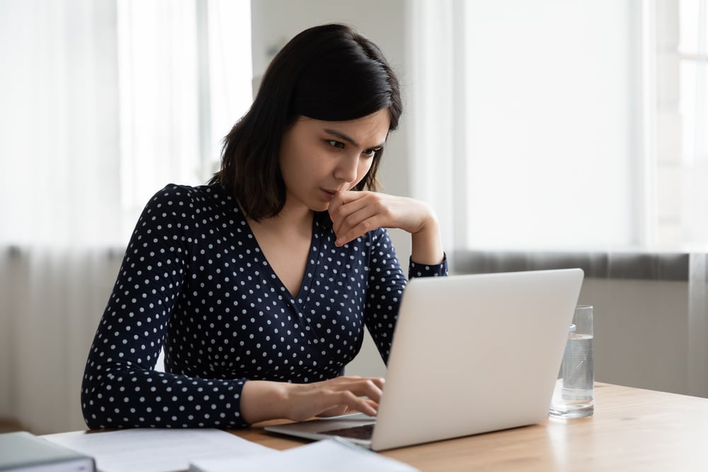 woman looking at laptop