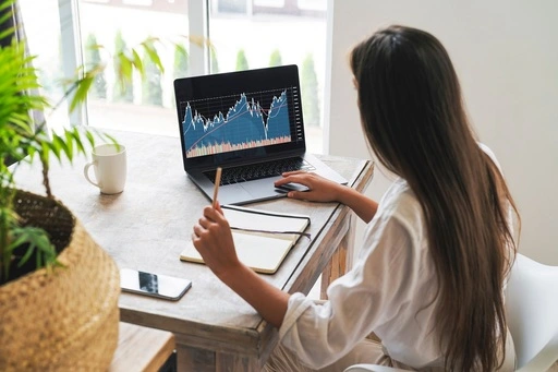 Woman working on laptop.