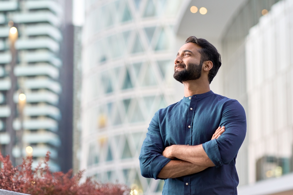 Business man standing with arms crossed