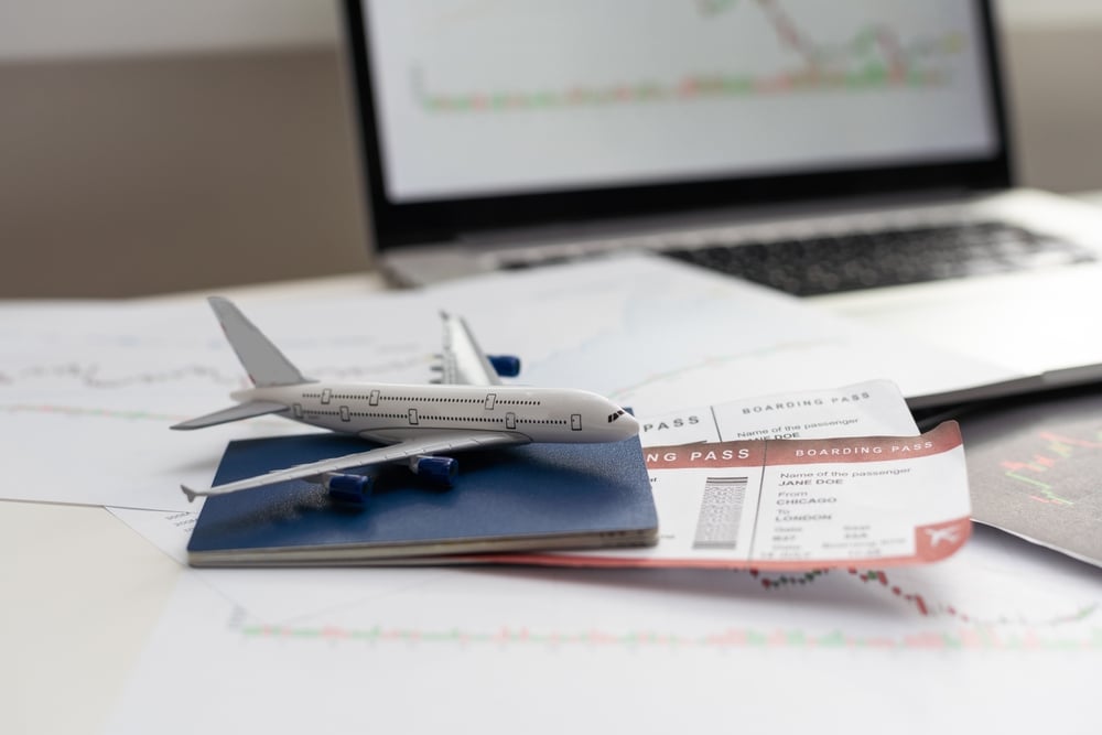 passport, boarding pass, airplane on desk