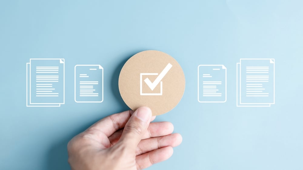 Document and checklist icons on blue background