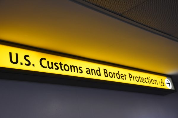 A sign for U.S. Customs and Border Protection (CBP) at an airport