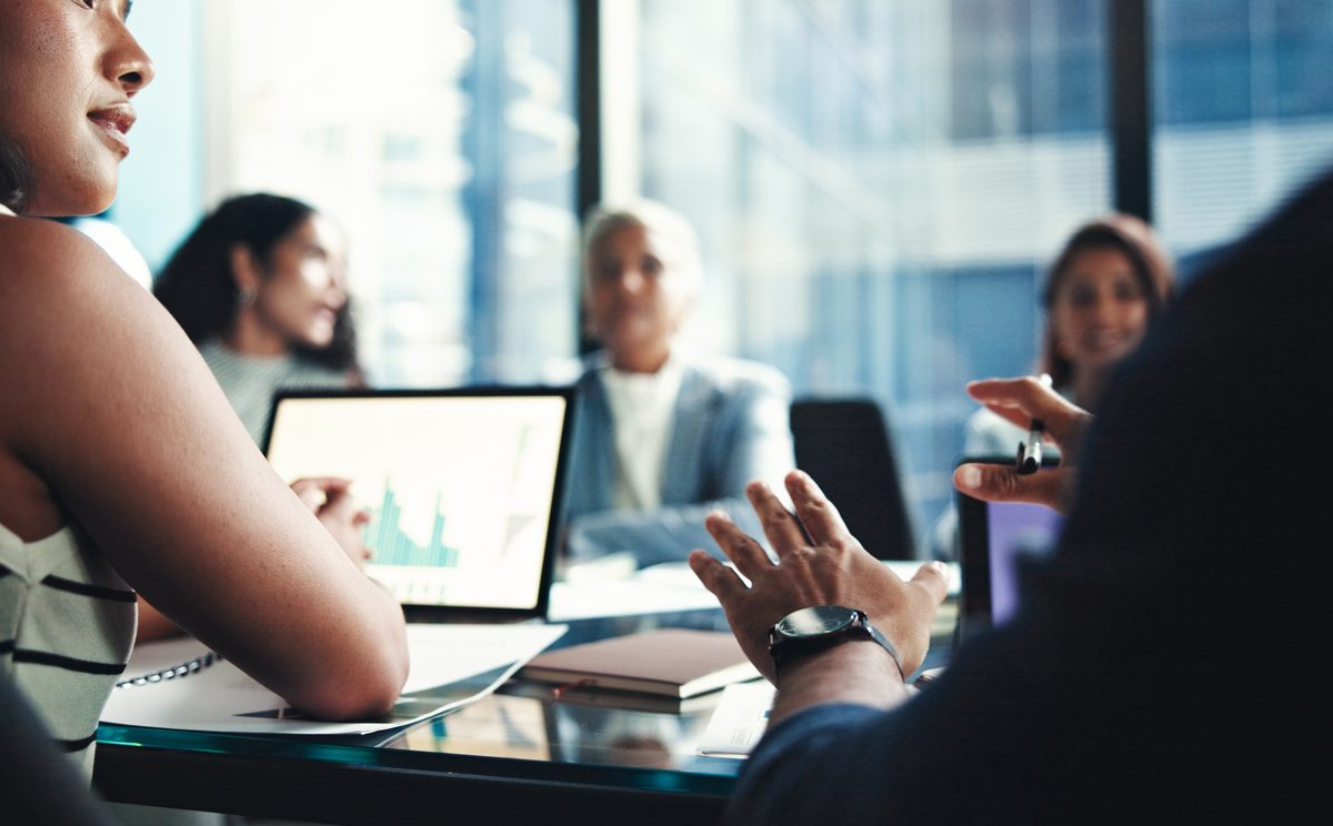 Investors at a meeting discussing their finances.