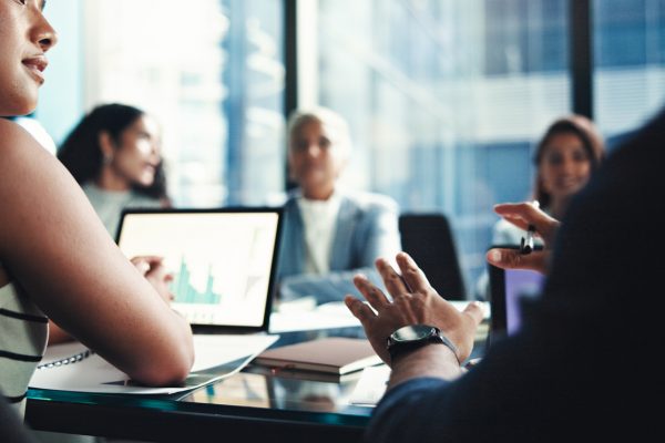 Investors at a meeting discussing their finances.