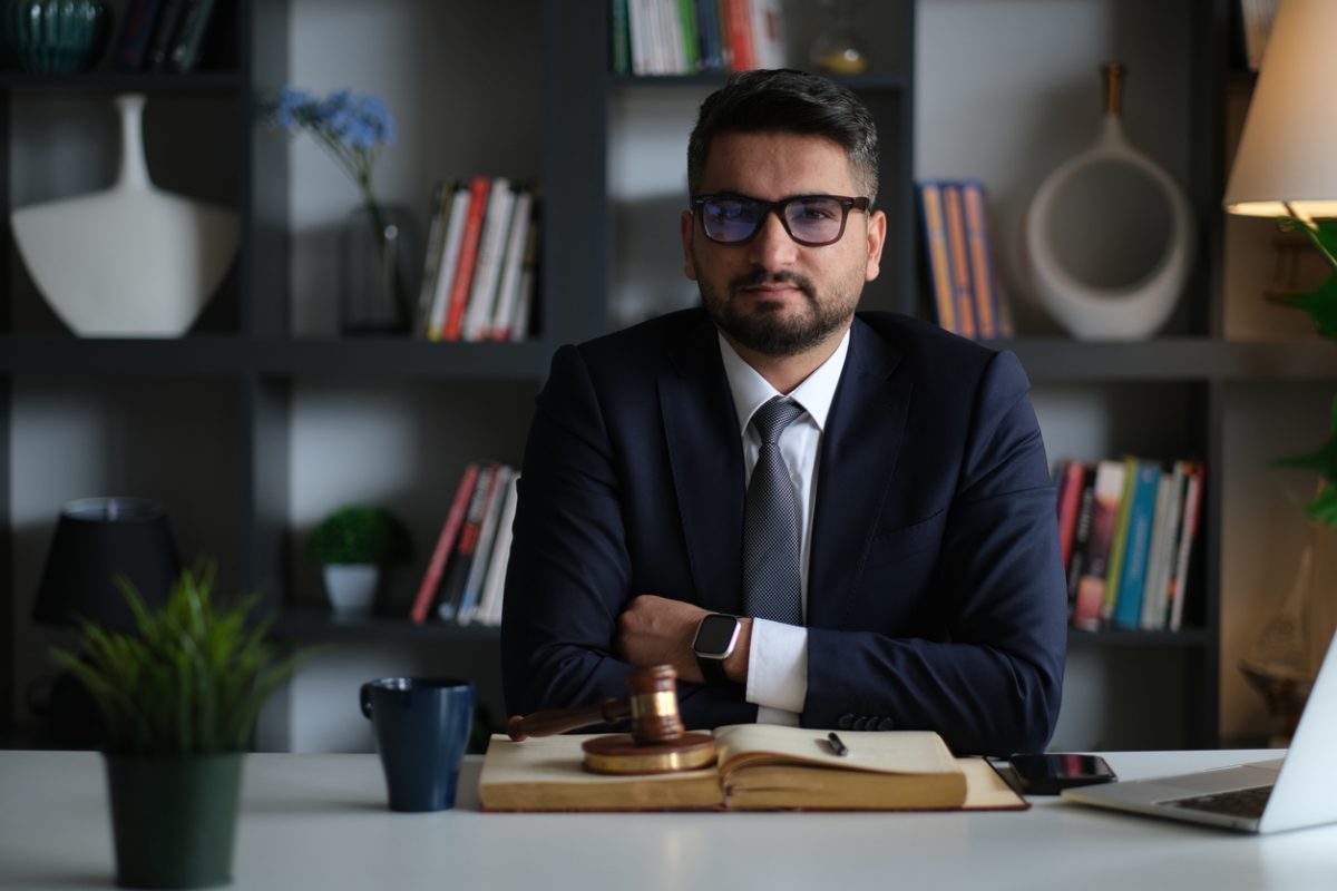 Lawyer sitting at office desk.