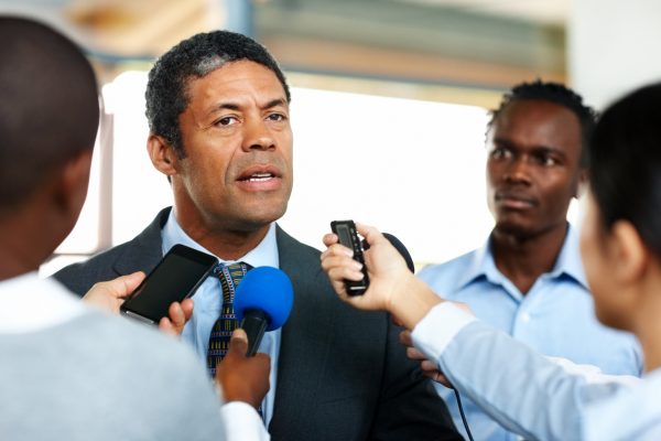 Business executive giving an interview to the press.