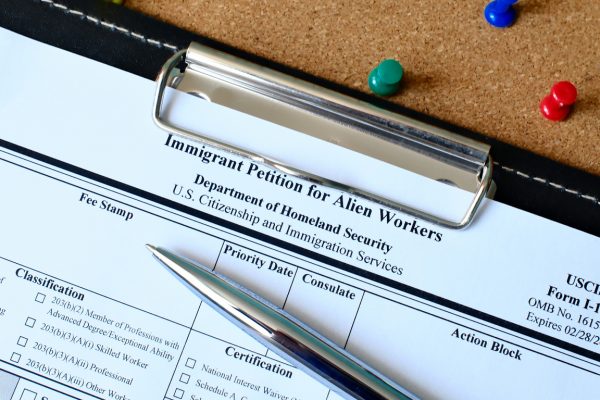 A closeup of USCIS Form I-140, Immigrant Petition for Alien Workers.