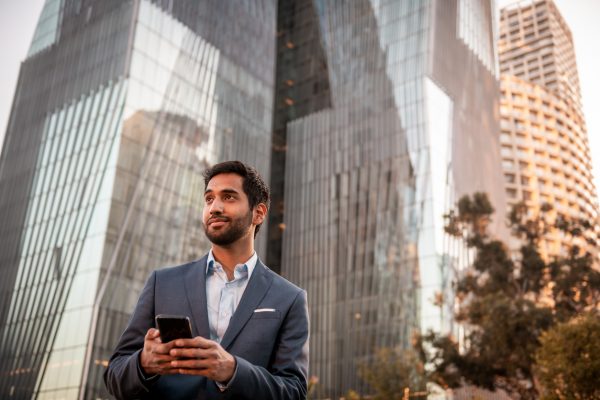 Portrait of a young businessman using a mobile phone