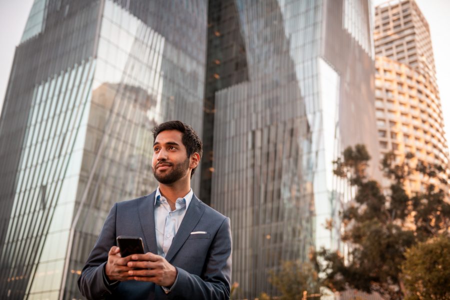 Portrait of a young businessman using a mobile phone