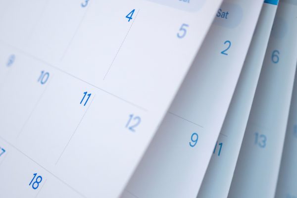 A closeup of calendar pages flipping
