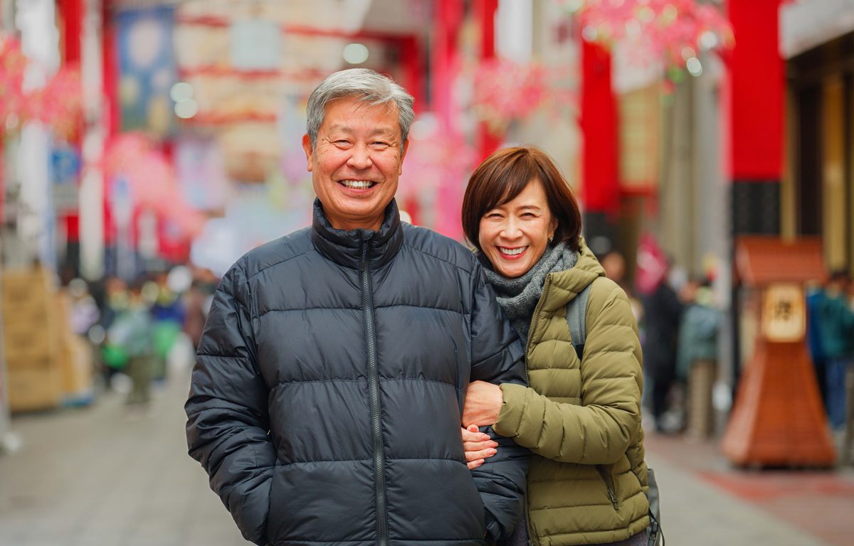 Married couple posing together in Tokyo, Japan.