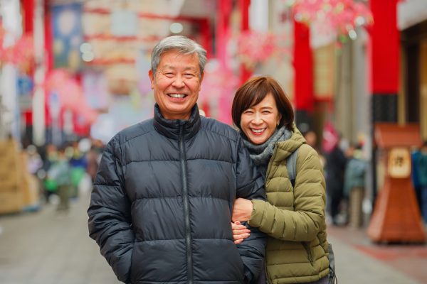 Married couple posing together in Tokyo, Japan.